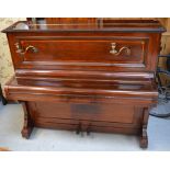 A John Broadwood & Sons of London upright piano with pair of brass sconces to the front,