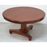 A mahogany circular coffee table modelled as a Victorian breakfast table,