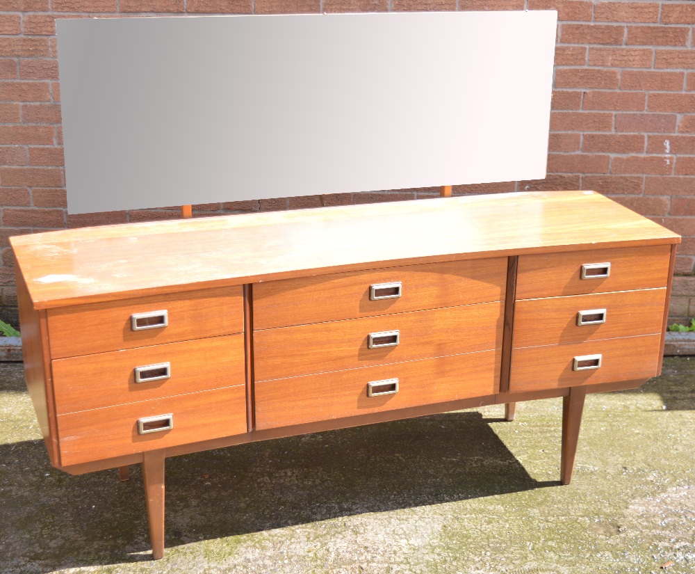 A retro teak nine drawer mirror back sideboard on tapering legs, width 155cm.