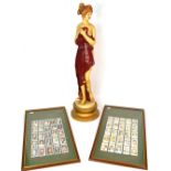 A large metal painted figurine of a semi-nude Grecian maiden,