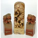 A Chinese carved soapstone seal decorated with a dragon and with all over foliate incised