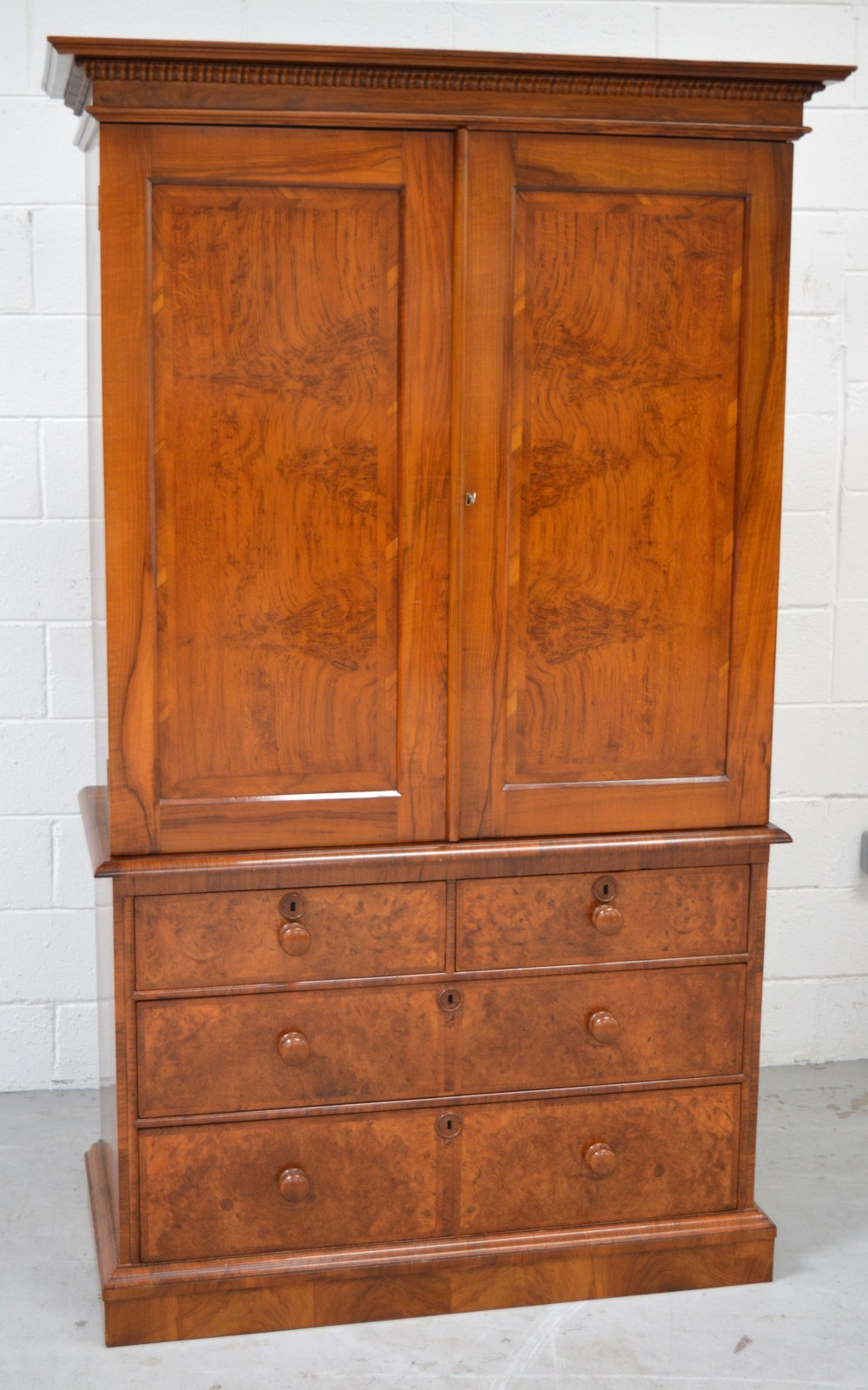 A walnut linen press,