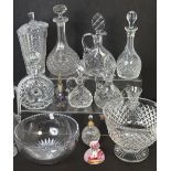 Two boxes of cut glass to include a set of three varying sized decanters,