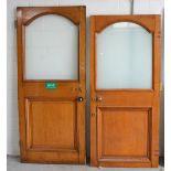 Two oak doors with arched opaque glass top over lower panel with some original door furniture,