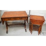 A reproduction Pembroke table with lyre style sides on paw feet and castors,