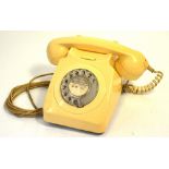 A vintage cream telephone.
