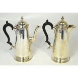 A George V hallmarked silver coffee pot and hot water jug in the Georgian manner,