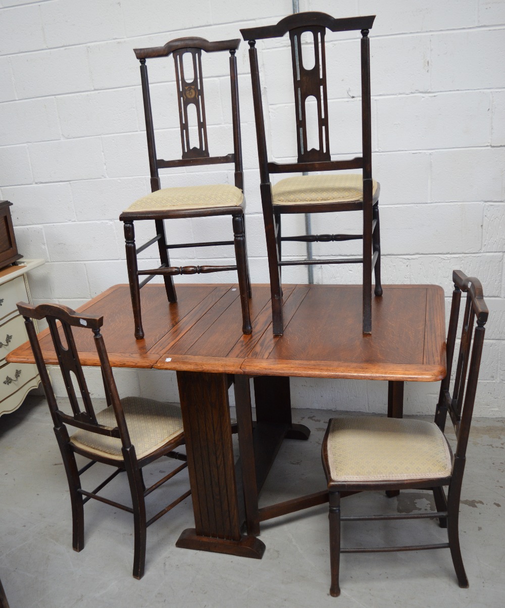 A c1940s dropleaf table and four mahogany Edwardian inlaid dining chairs on turned legs (5).