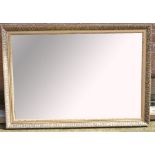 A modern gilt framed bevelled edge wall mirror, width 102cm.