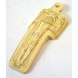 A late 19th century carved bone memento mori decorated as Jesus upon a stylised cross,