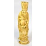 A Japanese Meiji period carved ivory okimono of a bearded gentleman wearing elaborate robes and