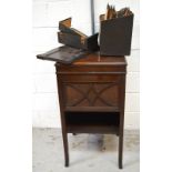 An oak HMV freestanding gramophone cabinet and a quantity of 78s.