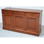 A mid 20th century mahogany sideboard with inlay, three drawers over three cupboard doors,