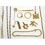 A small quantity of gold and yellow metal items to include a 9ct yellow gold tie clip,