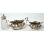 An Edward VII hallmarked silver twin handle basin and matching sauce boat, both Sheffield 1908,