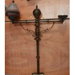 A bronzed two branch lamp, lacking one shade, height 88cm.