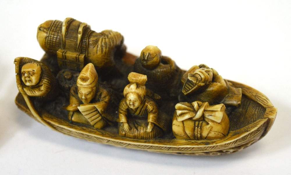 A Japanese Meiji period carved and stained netsuke modelled as five figures, - Image 4 of 4