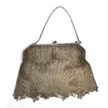 A silver mesh purse with simple chain loop and angled main frame, import marks 925, width 18cm,