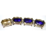 A set of four George V hallmarked silver open salts of oval form,