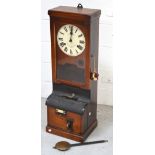 An early 20th century mahogany cased National Time Recorder with circular dial set with Roman