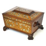 A large early Victorian rosewood and mother of pearl inlaid sewing box of sarcophagus form,