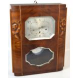 A large Art Deco wooden cased thirty hour chiming wall clock,