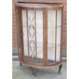 A retro single door bow-fronted display cabinet on cabriole legs, width 76cm.