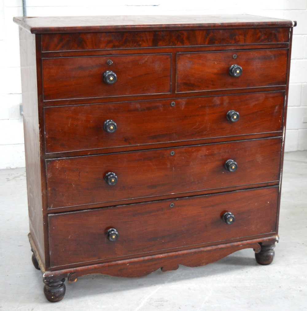 A Victorian mahogany two-over-three chest of drawers with secret top drawer and shaped apron,