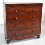 A Victorian mahogany two-over-three chest of drawers with secret top drawer and shaped apron,