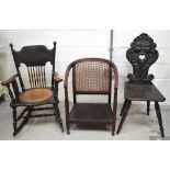 A heavily carved ebonised hall chair (af),