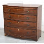 A George III mahogany bow front four drawer chest of drawers with string inlay and ivory