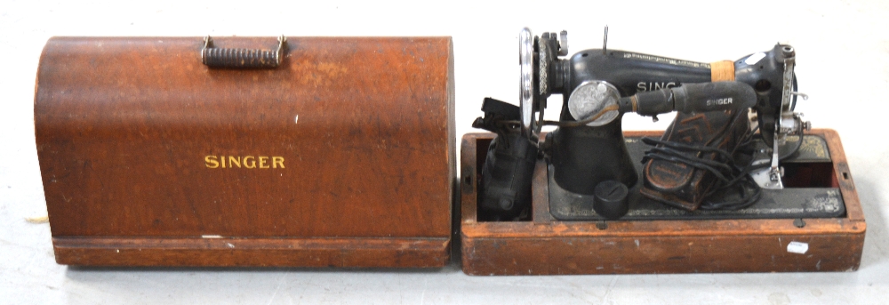 An oak cased Singer EA245228 sewing machine.