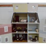 A modern dolls' house and a good quantity of dolls' house furniture.