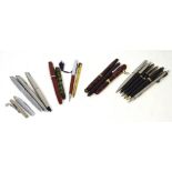 A small collection of pens to include a Waterman pen, two propelling pencils,