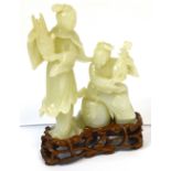 A fine Chinese very pale green jade group of two female musicians, one standing,