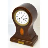 An Edwardian mahogany satinwood inlaid and boxwood strung balloon shaped mantel clock with circular