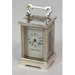 A Mappin & Webb white metal carriage clock of small proportions,