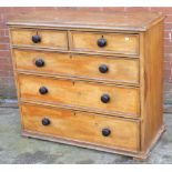 A stripped pine two-over-three chest of drawers, width 110cm.