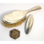 A George V hallmarked silver hand brush, Birmingham 1918, a George V hallmarked silver nail buffer,