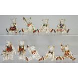 Nine miniature Royal Crown Derby teddy bears in various poses (9).