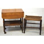 A late 19th century rush seat stool on turned legs and a small oak trolley on castors (2).