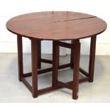 A 20th century dropleaf mahogany dining table on gateleg supports, length when extended 116cm.