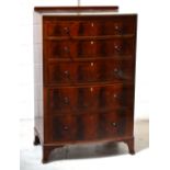 A 19th century bow-fronted mahogany five drawer chest of drawers with inlay on splayed bracket feet,