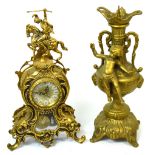 A modern ornate brass mantel clock, the dial set with Roman numerals,