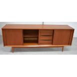 A large retro teak tambour-fronted sideboard on rounded tapering legs, length 215cm.