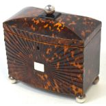 A Regency bow fronted pressed tortoiseshell tea caddy,