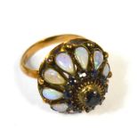 A 14ct gold dome shaped dress ring set with opals, size H, approx 4.5g.