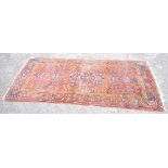 An antique Persian Hamadan rug with all over floral tree and foliage design in multicolour on a