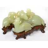 A fine Chinese Qianlong pale green/mutton fat carved jade group modelled as three recumbent rams