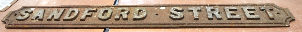 A cast iron 'Sandford Street' road sign in very weathered condition, length 146cm.